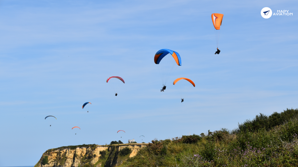 Paragliding is done on hillsides and mountains.